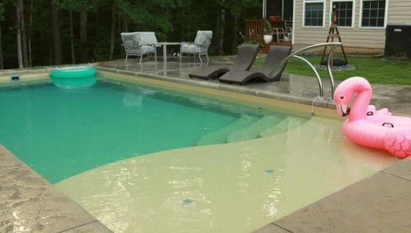 Sandstone fiberglass pool with tanning ledge