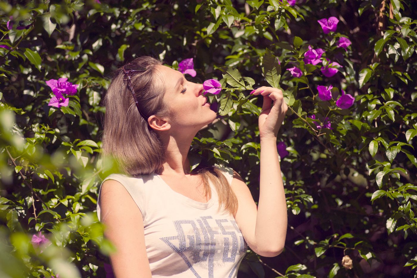 lady-smelling-a-flower.jpeg