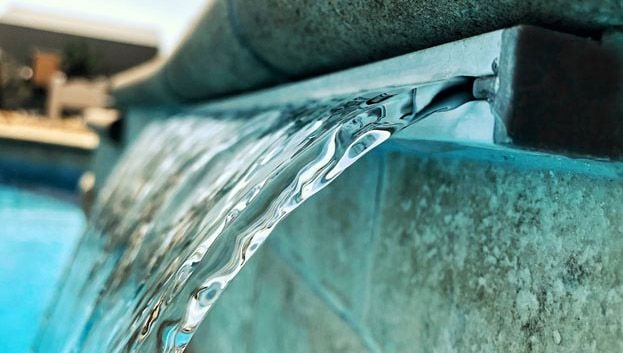 Cascade water feature for swimming pool