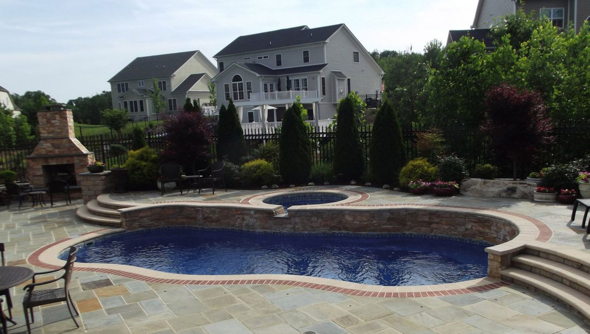 inground fiberglass pool with retaining wall