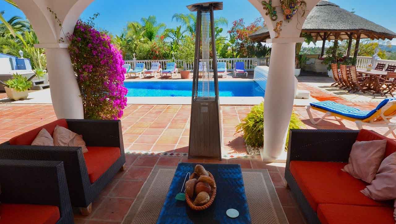 Outdoor living space with pool and furniture