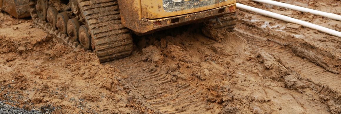 skid-loader-muddy-tracks-header