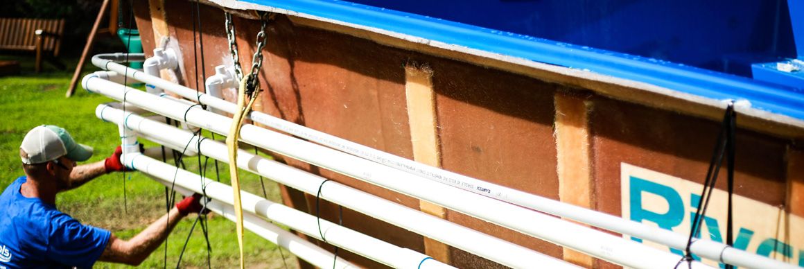 tying-straps-around-pool-plumbing-header